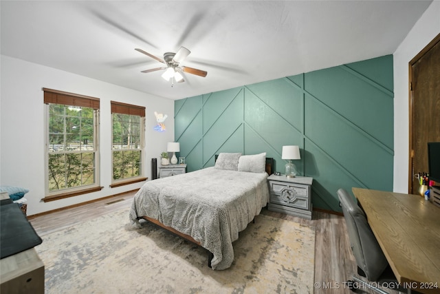 bedroom featuring ceiling fan and hardwood / wood-style floors