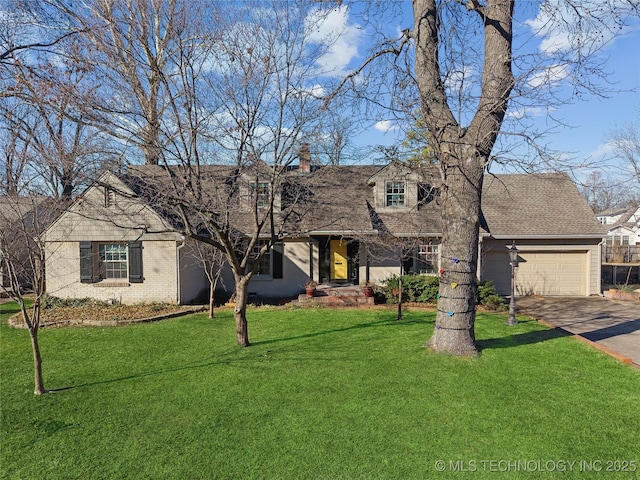 view of front of home with a garage and a front yard