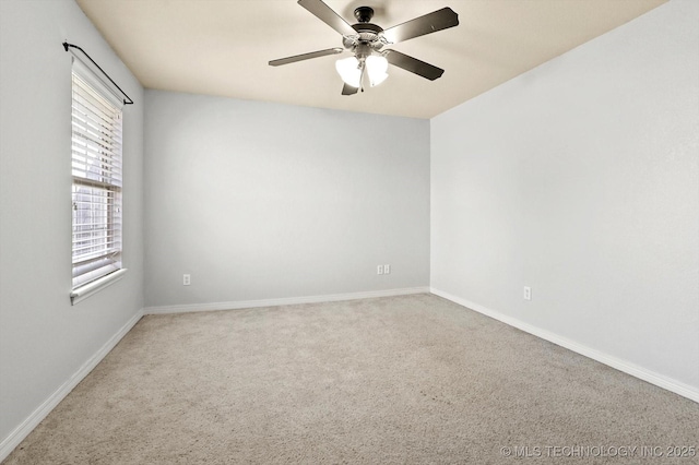 carpeted empty room featuring ceiling fan