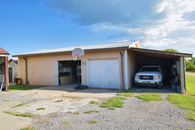 garage featuring wooden walls