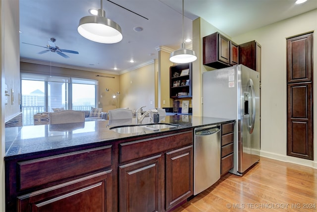 kitchen featuring light hardwood / wood-style floors, pendant lighting, stainless steel appliances, ceiling fan, and sink