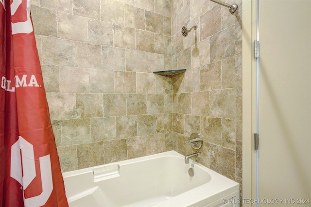 bathroom with shower / bathtub combination with curtain