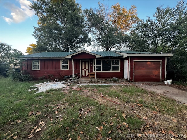 ranch-style house featuring a garage