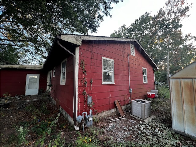 view of home's exterior with central AC