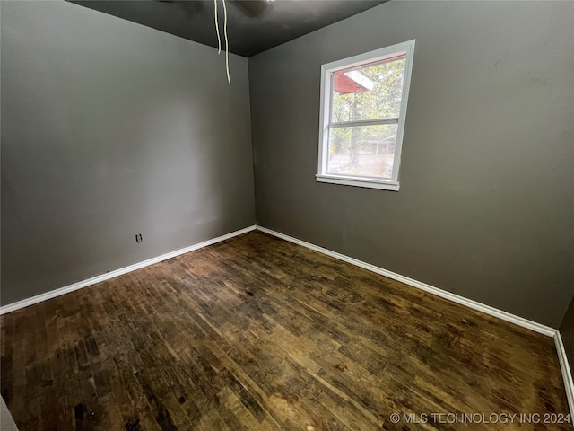 unfurnished room with ceiling fan and hardwood / wood-style flooring