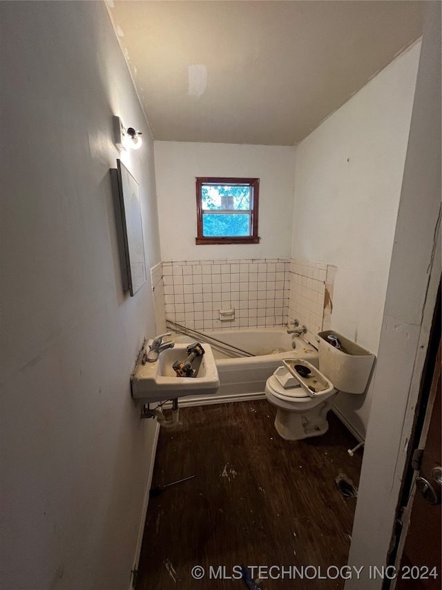 bathroom with a bath, wood-type flooring, toilet, and sink