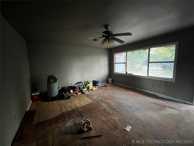 spare room featuring ceiling fan and hardwood / wood-style floors