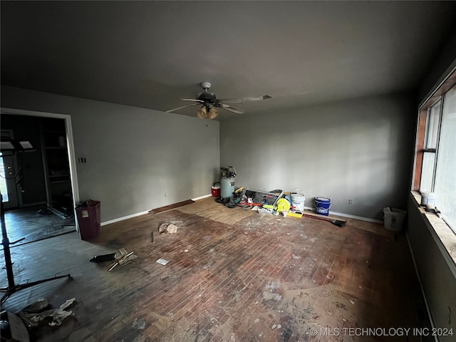 unfurnished room featuring hardwood / wood-style floors and ceiling fan