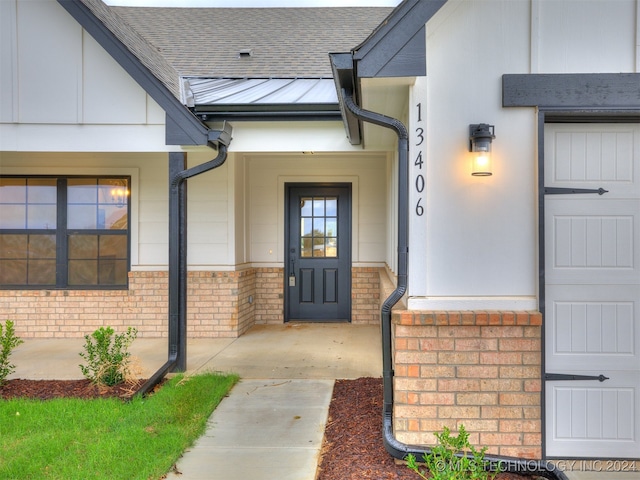 entrance to property featuring a garage