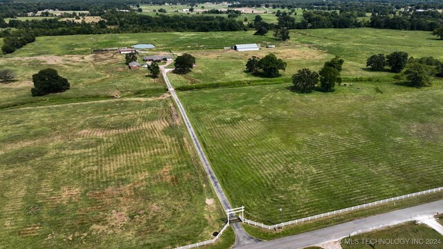 birds eye view of property featuring a rural view