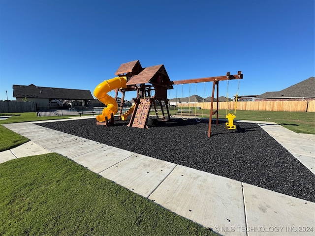 view of playground featuring a lawn