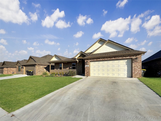 view of front facade with a garage and a front lawn