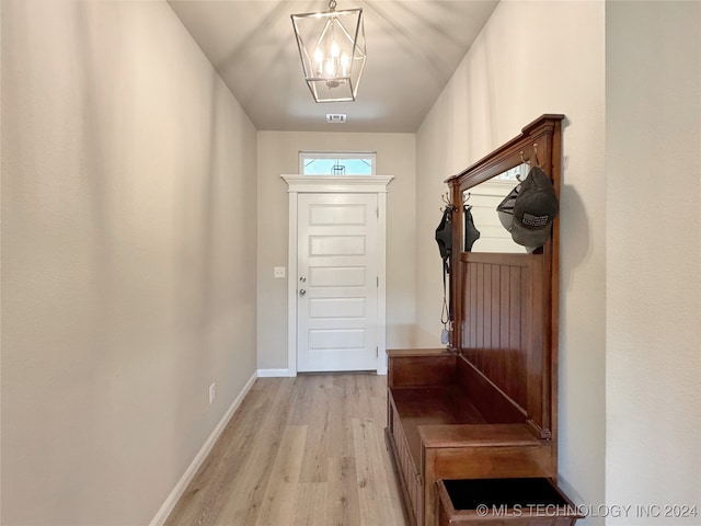 mudroom with light hardwood / wood-style floors and a chandelier