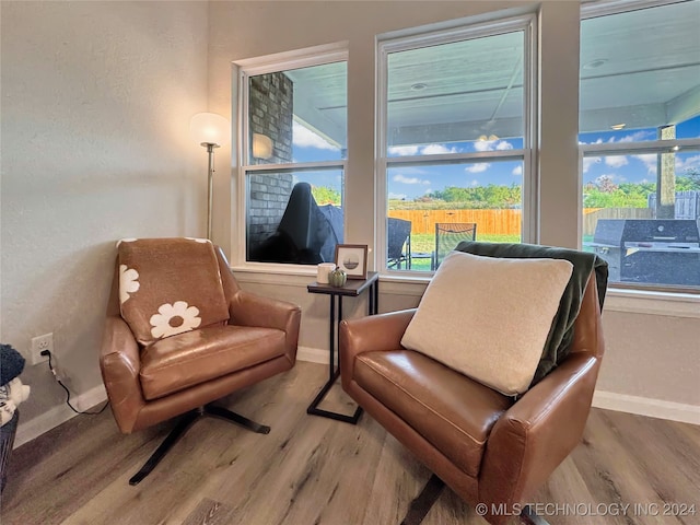 living area with hardwood / wood-style floors