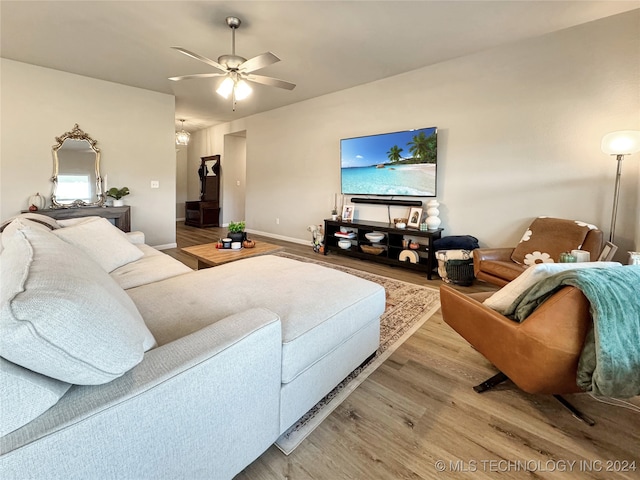 living room with light wood-type flooring and ceiling fan