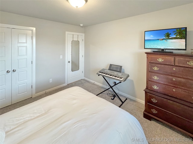 bedroom featuring light colored carpet