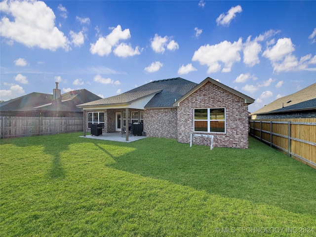 rear view of property with central AC, a lawn, and a patio area