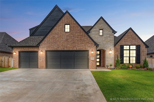 view of front of house with a lawn and a garage