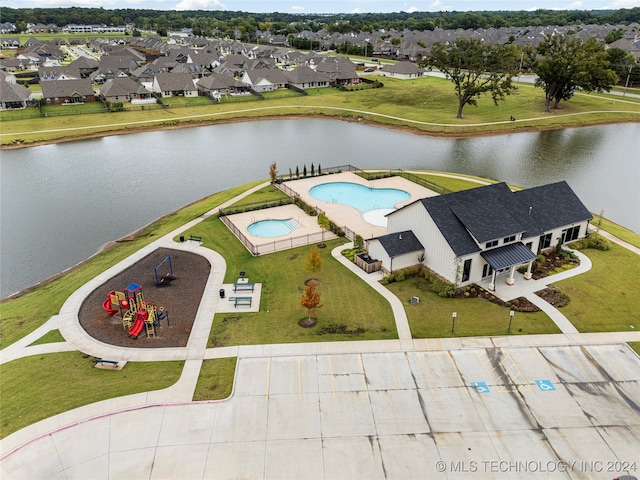 birds eye view of property with a water view