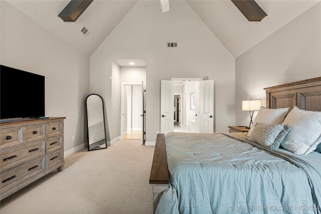 bedroom with light carpet, high vaulted ceiling, and ceiling fan