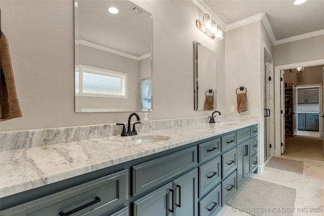 bathroom with ornamental molding and vanity