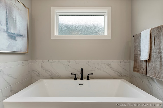 bathroom featuring a tub