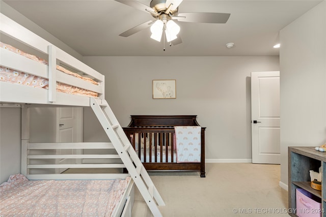 bedroom featuring light carpet and ceiling fan