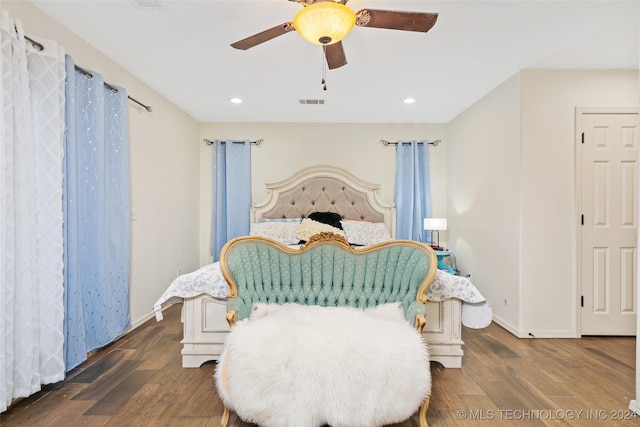 bedroom featuring ceiling fan and dark hardwood / wood-style floors