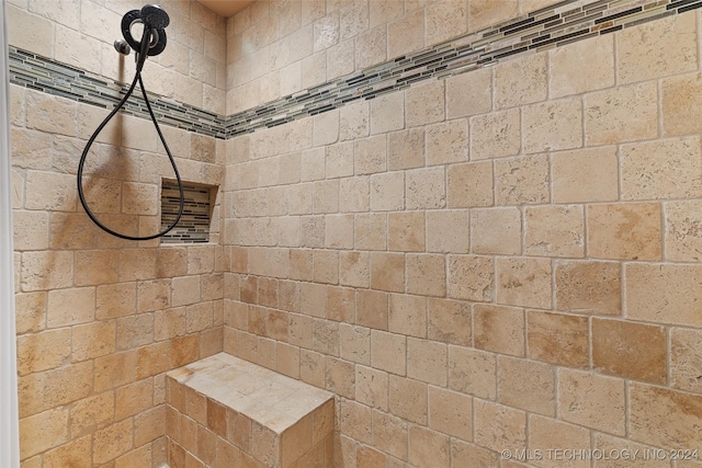 bathroom featuring tiled shower