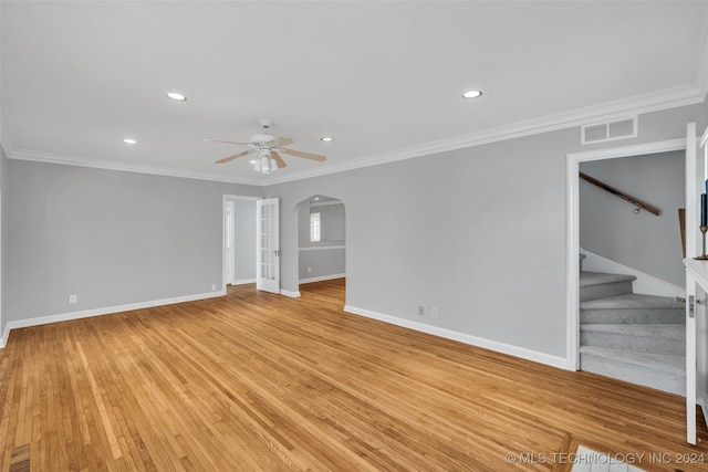 empty room featuring ornamental molding, ceiling fan, and light hardwood / wood-style flooring