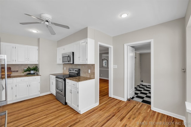 kitchen featuring light hardwood / wood-style floors, white cabinetry, ceiling fan, and stainless steel appliances