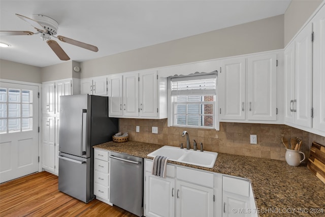 kitchen featuring stainless steel appliances, white cabinetry, and ceiling fan