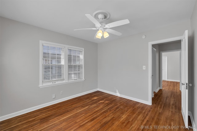 unfurnished room with ceiling fan and hardwood / wood-style flooring