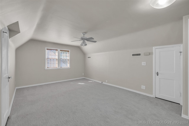 bonus room featuring lofted ceiling, ceiling fan, and light colored carpet