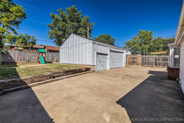 view of patio / terrace with a playground and a storage unit