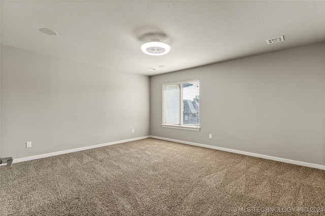 unfurnished room featuring carpet floors