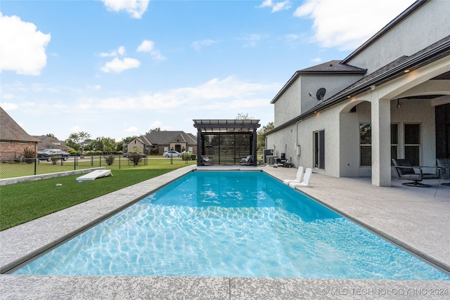 view of swimming pool featuring a pergola, a yard, and a patio