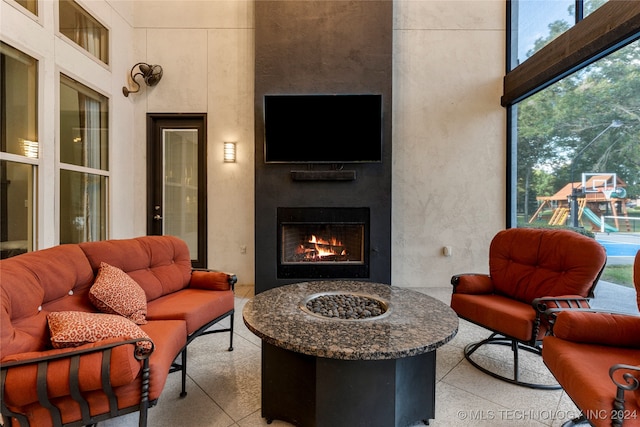 living room with a high ceiling