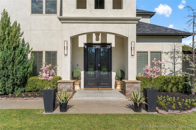 doorway to property featuring french doors