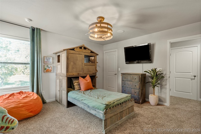 bedroom featuring ceiling fan and light colored carpet