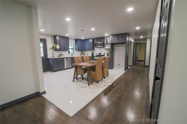 dining area featuring sink and hardwood / wood-style flooring