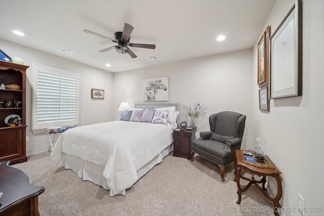 bedroom featuring ceiling fan and light colored carpet