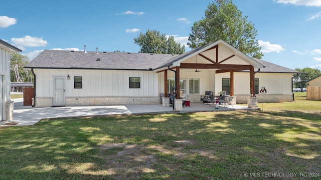 rear view of house with a lawn, ceiling fan, and a patio area