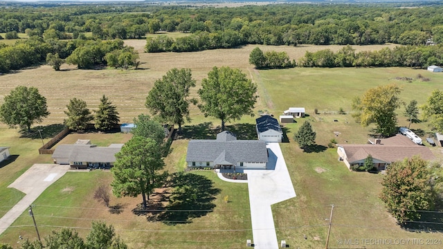 birds eye view of property with a rural view