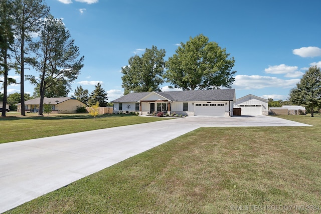 single story home featuring a garage and a front yard