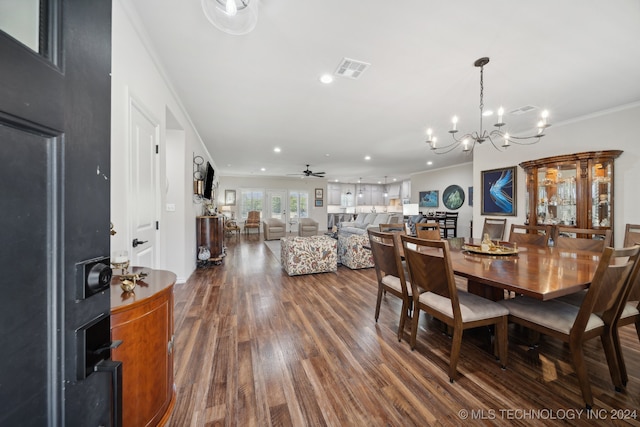 dining area featuring ceiling fan with notable chandelier, crown molding, and hardwood / wood-style floors