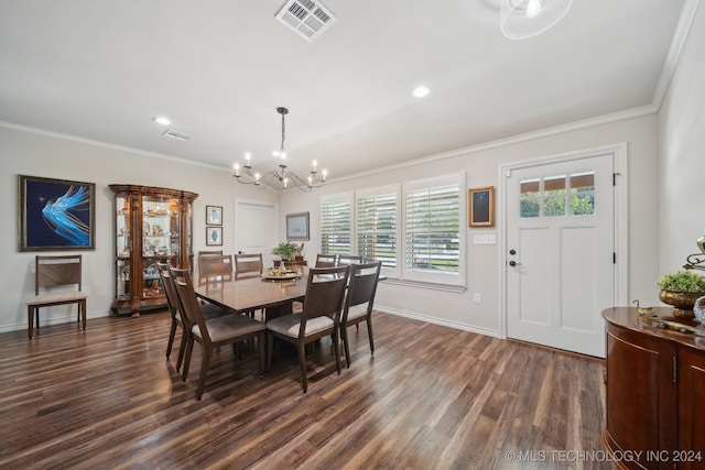 dining area featuring a notable chandelier, dark wood-type flooring, and crown molding