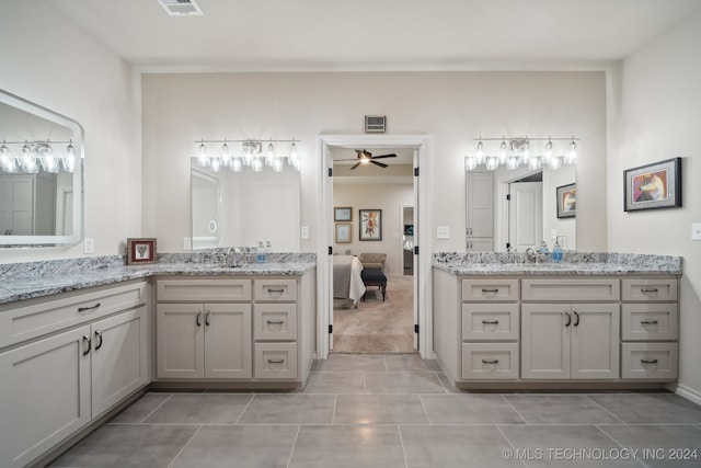 bathroom featuring tile patterned flooring, ceiling fan, and vanity