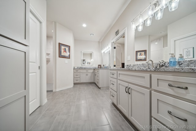 bathroom with vanity and tile patterned floors