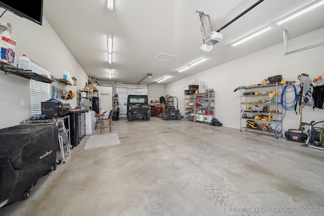 garage featuring a garage door opener